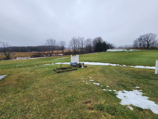 view of yard with a rural view