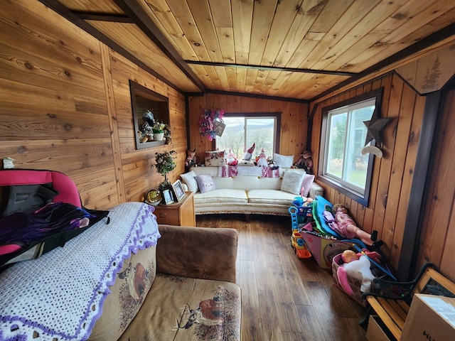 interior space with dark hardwood / wood-style flooring, wood ceiling, and wooden walls