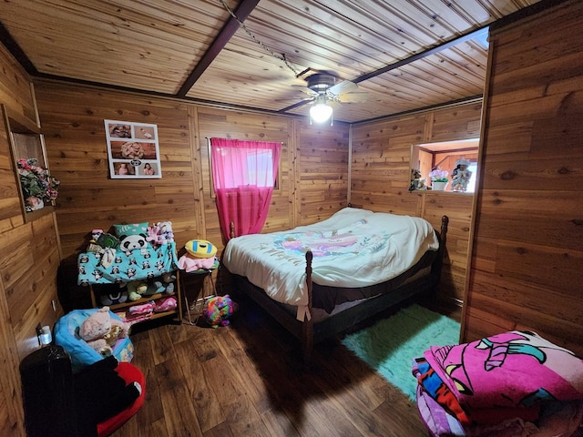 bedroom with ceiling fan, wooden ceiling, wood walls, and wood-type flooring