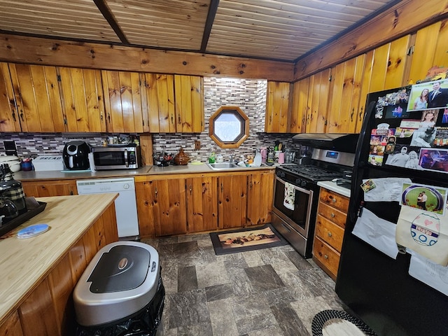 kitchen with sink, wooden ceiling, stainless steel appliances, and tasteful backsplash