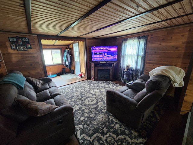 living room featuring wood walls and wood ceiling