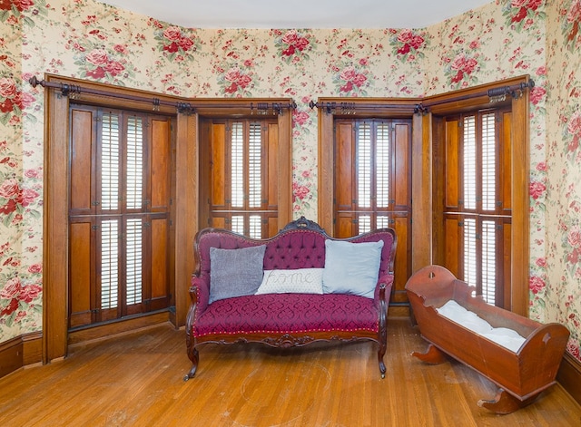 sitting room with hardwood / wood-style floors and plenty of natural light