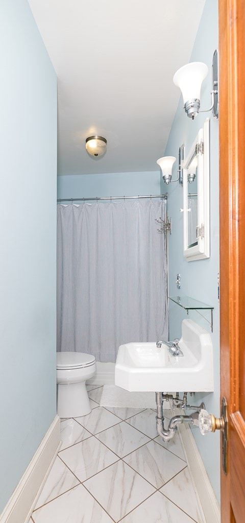 bathroom with toilet and sink