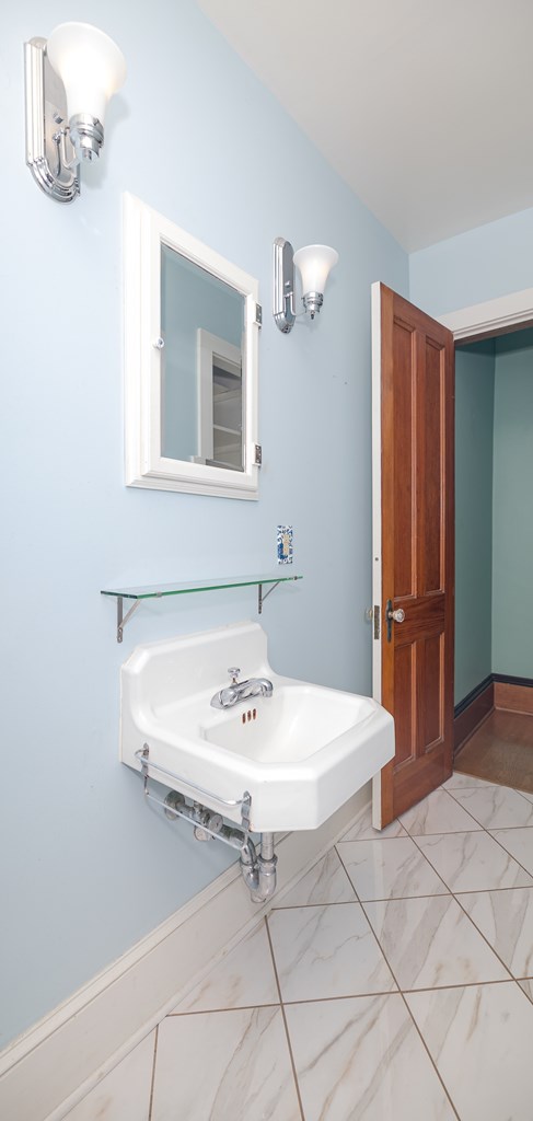 bathroom featuring tile patterned flooring and sink