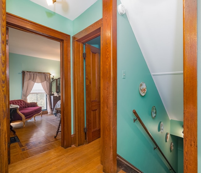 hallway with light hardwood / wood-style flooring