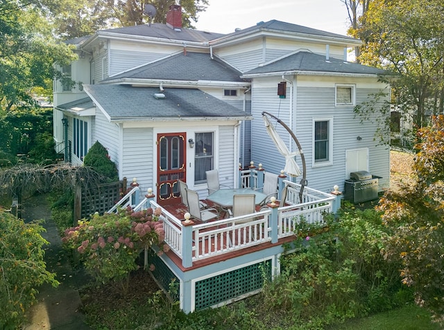 rear view of house with a deck