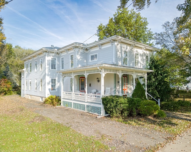 italianate home featuring a porch