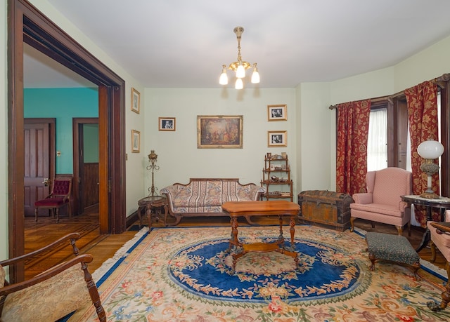 living room with a chandelier and hardwood / wood-style floors