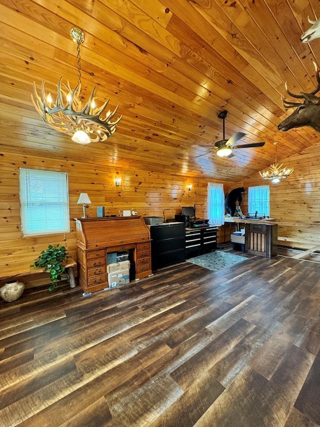 interior space with ceiling fan with notable chandelier