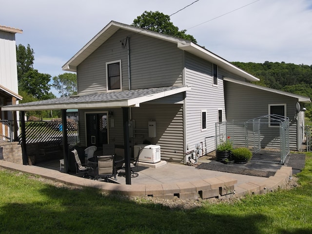 rear view of property featuring a patio