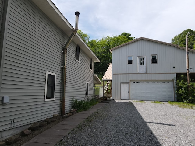 view of side of home with a garage