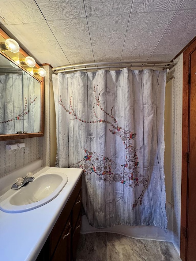 bathroom featuring a shower with curtain and vanity