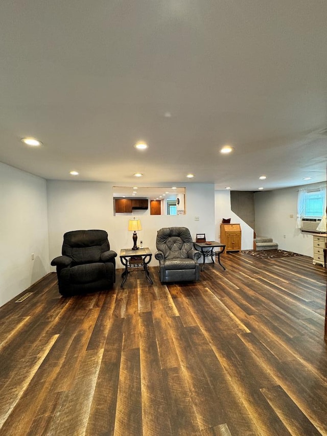 living room featuring dark hardwood / wood-style flooring