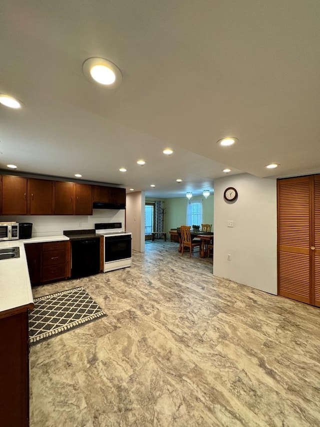 kitchen featuring white electric range, dark brown cabinetry, and sink