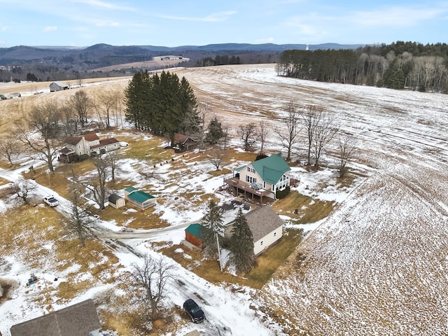 snowy aerial view featuring a mountain view