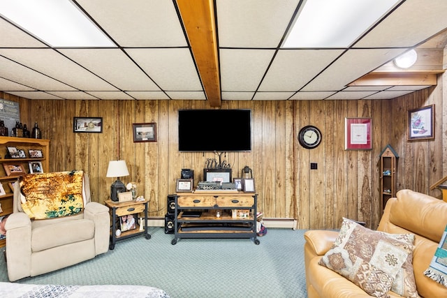 carpeted living room featuring a paneled ceiling and a baseboard heating unit