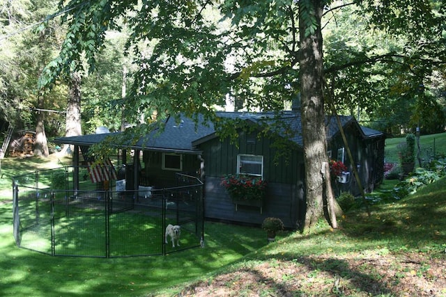 view of side of home with a lawn