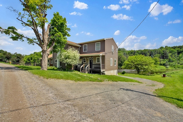 658 Ashley Hill Rd, Mansfield, PA 16933 - view of front of property featuring a porch, dirt driveway, and a front yard