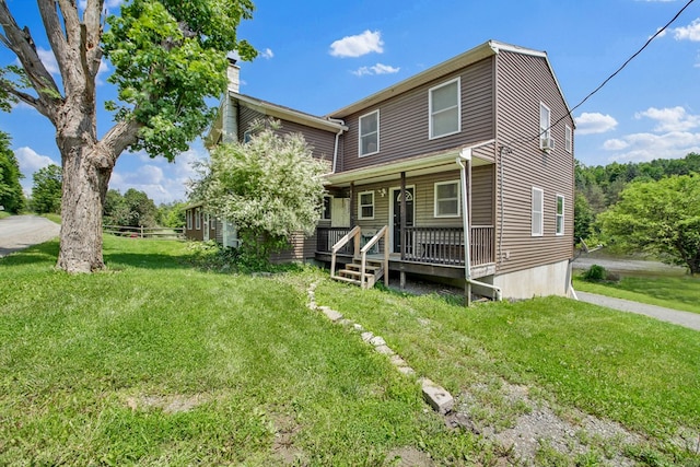658 Ashley Hill Rd, Mansfield, PA 16933 - view of front of property featuring a chimney, covered porch, and a front yard