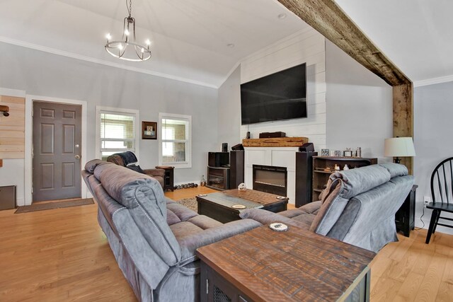 658 Ashley Hill Rd, Mansfield, PA 16933 - living area featuring crown molding, light wood-style flooring, lofted ceiling, and a chandelier