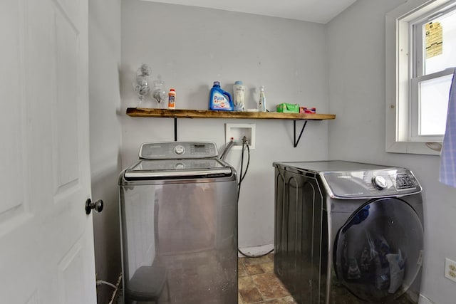 658 Ashley Hill Rd, Mansfield, PA 16933 - washroom with washing machine and dryer and stone finish flooring
