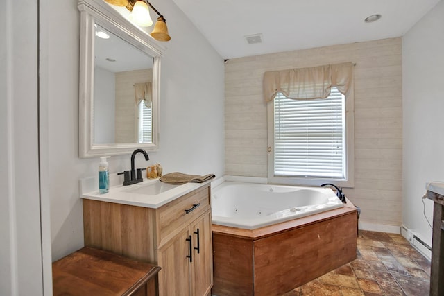 658 Ashley Hill Rd, Mansfield, PA 16933 - bathroom with vanity, a whirlpool tub, stone finish floors, and baseboard heating