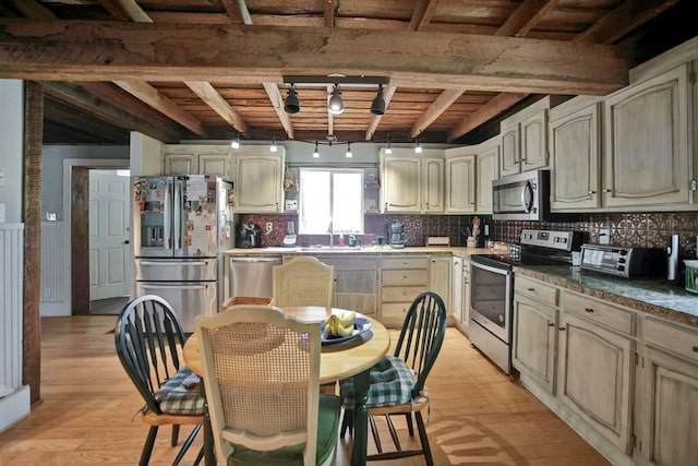 658 Ashley Hill Rd, Mansfield, PA 16933 - kitchen with appliances with stainless steel finishes, light wood-style floors, a wooden ceiling with exposed beams, decorative backsplash, and cream cabinetry