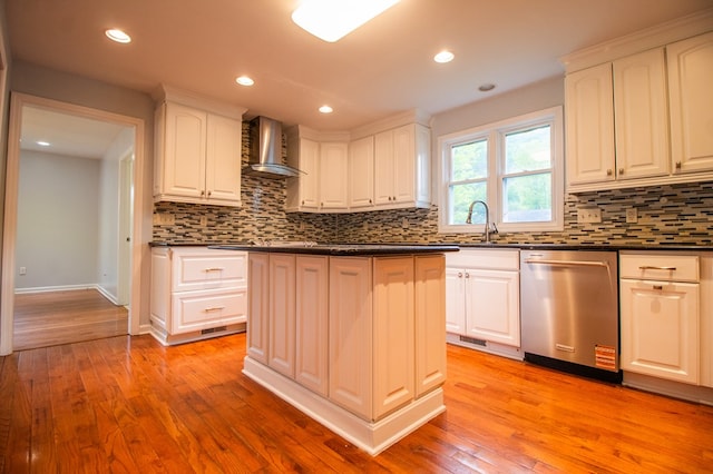 15 Loomis Ln, Gillett, PA 16925 - kitchen with stainless steel dishwasher, wall chimney range hood, dark countertops, a sink, and recessed lighting