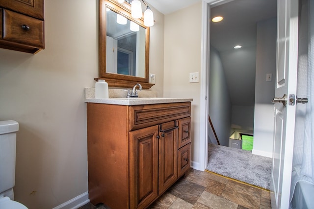 15 Loomis Ln, Gillett, PA 16925 - half bathroom with toilet, vanity, baseboards, stone finish floors, and recessed lighting