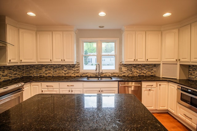 15 Loomis Ln, Gillett, PA 16925 - kitchen with a sink, stainless steel appliances, dark stone counters, white cabinetry, and tasteful backsplash