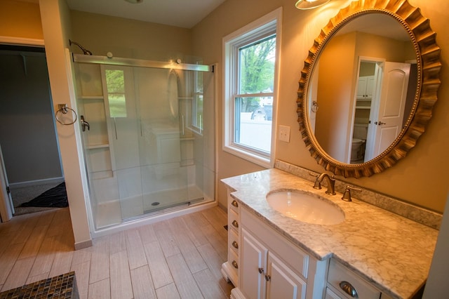 15 Loomis Ln, Gillett, PA 16925 - bathroom featuring a stall shower, wood finished floors, vanity, and toilet