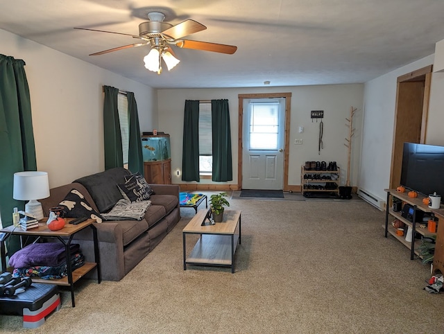 carpeted living room with ceiling fan and a baseboard radiator