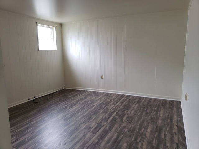 empty room featuring dark hardwood / wood-style floors