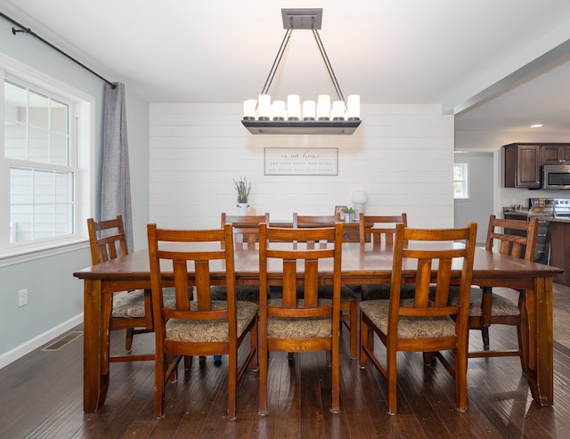 113 W Woodlawn Ave, Elkland, PA 16920 - dining room with dark wood-style flooring, baseboards, and wood walls