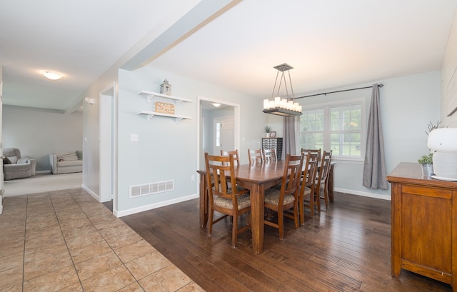 113 W Woodlawn Ave, Elkland, PA 16920 - dining room with dark wood-type flooring, baseboards, and a chandelier