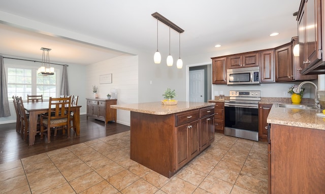113 W Woodlawn Ave, Elkland, PA 16920 - kitchen featuring appliances with stainless steel finishes, a sink, a center island, decorative light fixtures, and recessed lighting