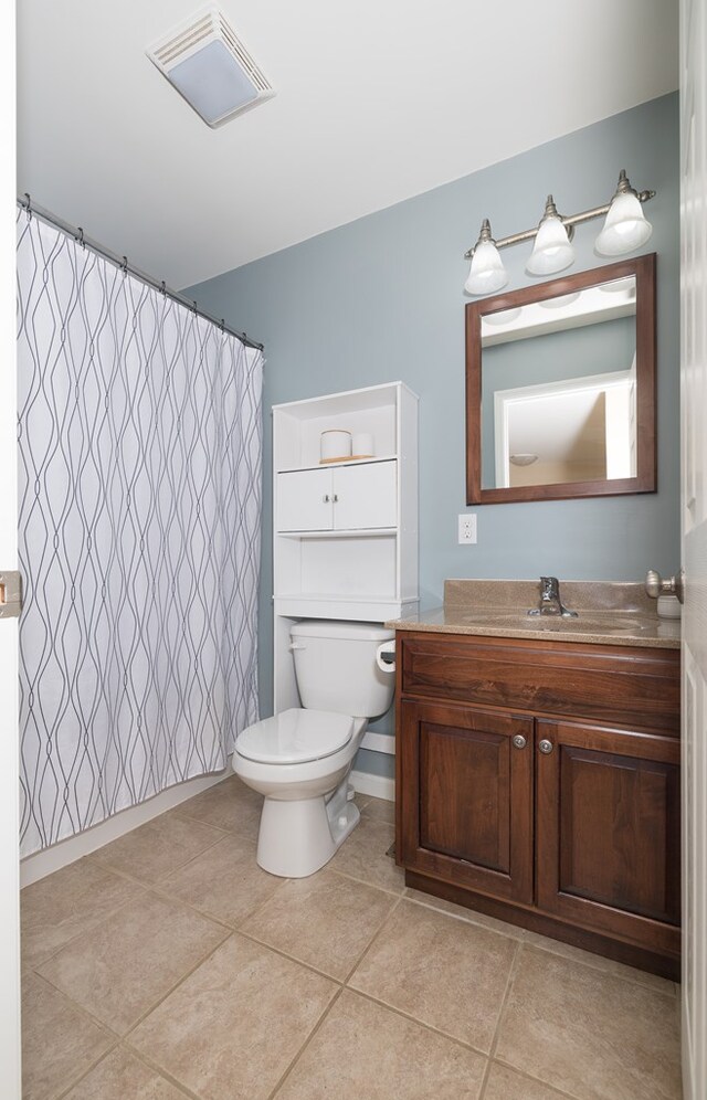 113 W Woodlawn Ave, Elkland, PA 16920 - bathroom featuring toilet, vanity, tile patterned flooring, and a shower with curtain
