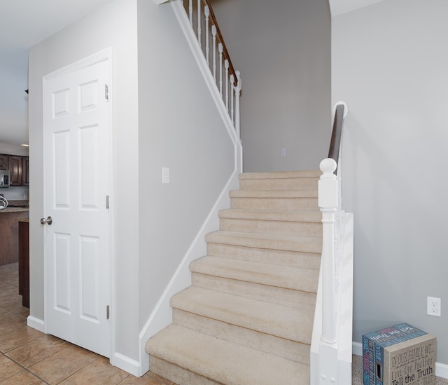 113 W Woodlawn Ave, Elkland, PA 16920 - staircase featuring baseboards and tile patterned floors