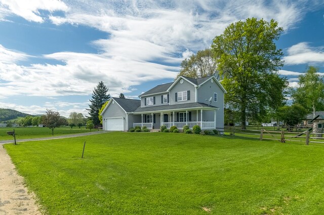 113 W Woodlawn Ave, Elkland, PA 16920 - view of front of house featuring a porch, an attached garage, and driveway