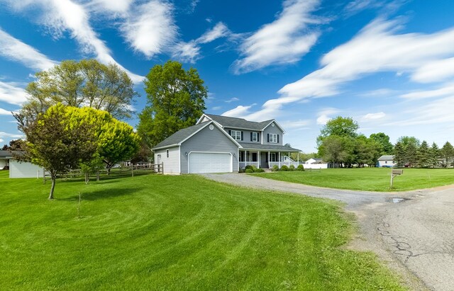 113 W Woodlawn Ave, Elkland, PA 16920 - view of front of property featuring dirt driveway, an attached garage, and covered porch