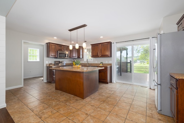 113 W Woodlawn Ave, Elkland, PA 16920 - kitchen featuring stainless steel appliances, a center island, a sink, recessed lighting, and hanging light fixtures