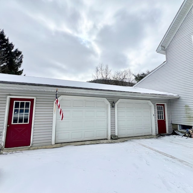 view of snow covered garage