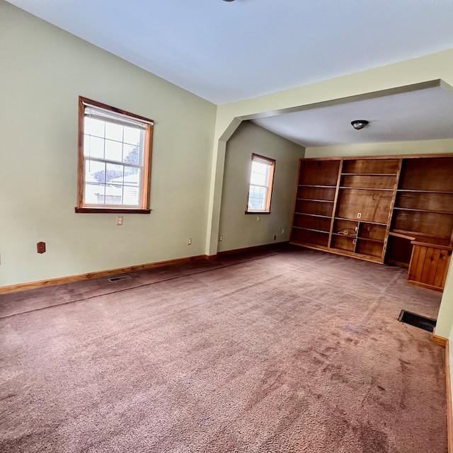 unfurnished living room with light carpet