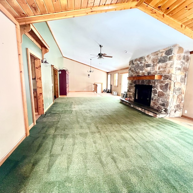 unfurnished living room with a fireplace, ceiling fan, carpet flooring, and lofted ceiling