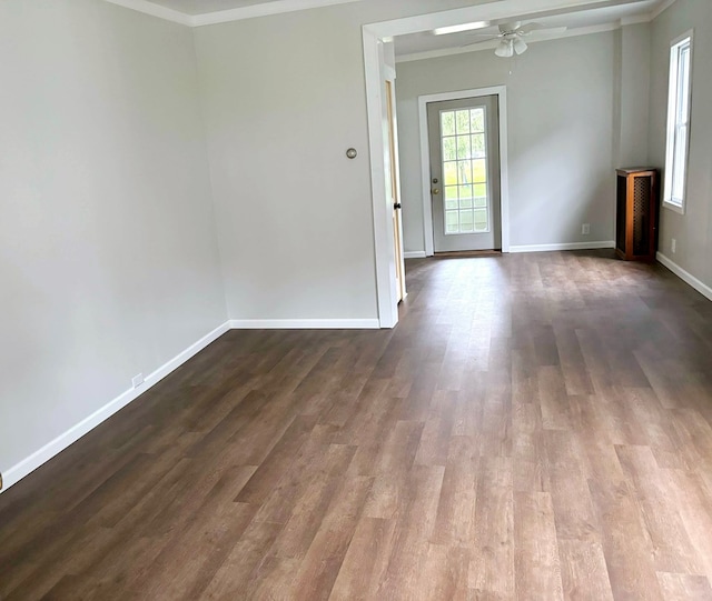 spare room with hardwood / wood-style flooring, ceiling fan, and crown molding