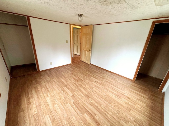 unfurnished bedroom featuring light wood-type flooring