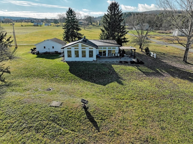 birds eye view of property featuring a rural view