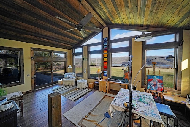 sunroom / solarium featuring plenty of natural light, lofted ceiling with beams, wood ceiling, and ceiling fan