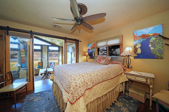 bedroom featuring ceiling fan and dark hardwood / wood-style flooring