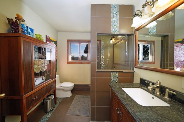 bathroom featuring tile patterned floors, walk in shower, vanity, a baseboard heating unit, and toilet